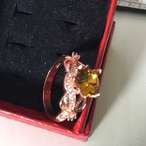 Elegant Gold Ring with Yellow Stone and Twisted Design